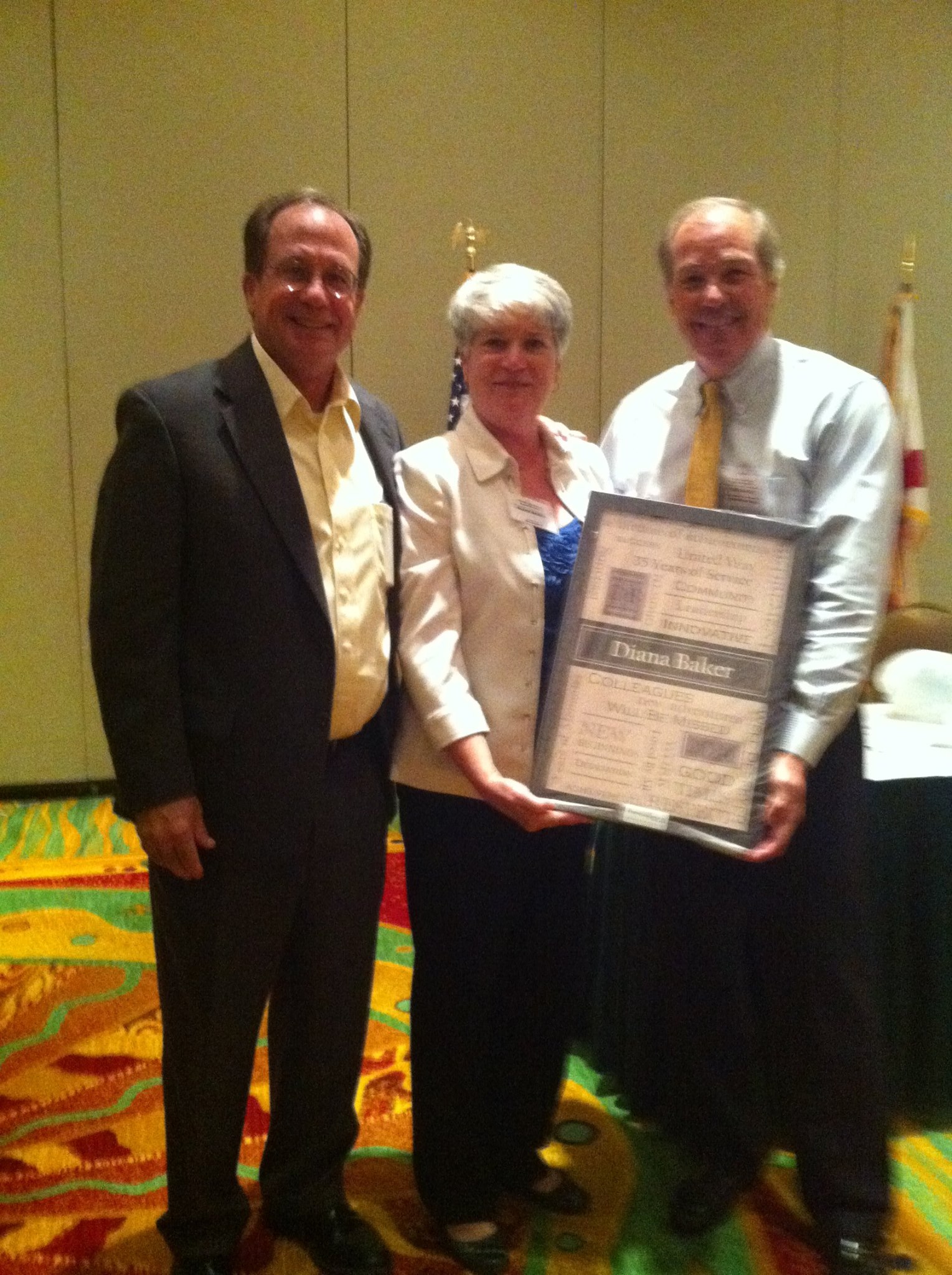 2014 August Board & CEO meeting (Ted Granger and Chair Kip Jacoby presenting Diana Baker with a gift in honor of her retirement)